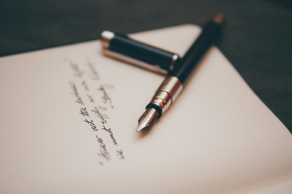 Photo of pen and handwritten text with signature Photo of pen and handwritten text with signature